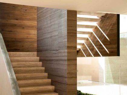 A Steel, Glass, Stone and Colored Concrete Home with Dramatic Central Staircase in Mexico City by Gantous Arquitectos (18)