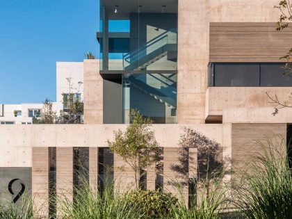 A Steel, Glass, Stone and Colored Concrete Home with Dramatic Central Staircase in Mexico City by Gantous Arquitectos (2)