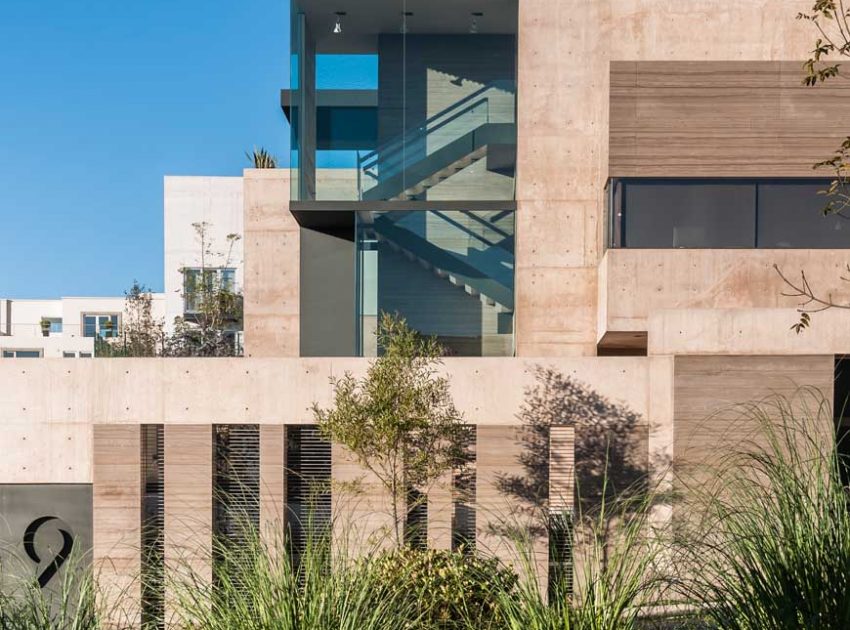 A Steel, Glass, Stone and Colored Concrete Home with Dramatic Central Staircase in Mexico City by Gantous Arquitectos (2)