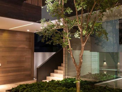 A Steel, Glass, Stone and Colored Concrete Home with Dramatic Central Staircase in Mexico City by Gantous Arquitectos (21)