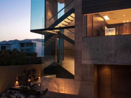 A Steel, Glass, Stone and Colored Concrete Home with Dramatic Central Staircase in Mexico City by Gantous Arquitectos (22)