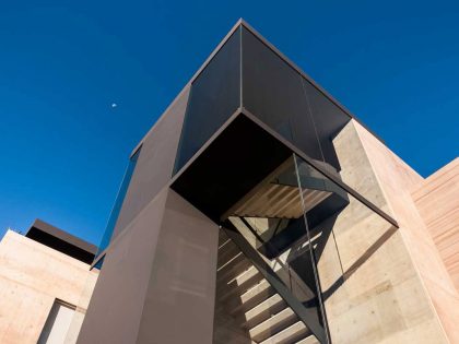 A Steel, Glass, Stone and Colored Concrete Home with Dramatic Central Staircase in Mexico City by Gantous Arquitectos (4)