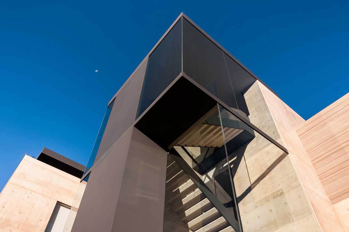 A Steel, Glass, Stone and Colored Concrete Home with Dramatic Central Staircase in Mexico City by Gantous Arquitectos (4)