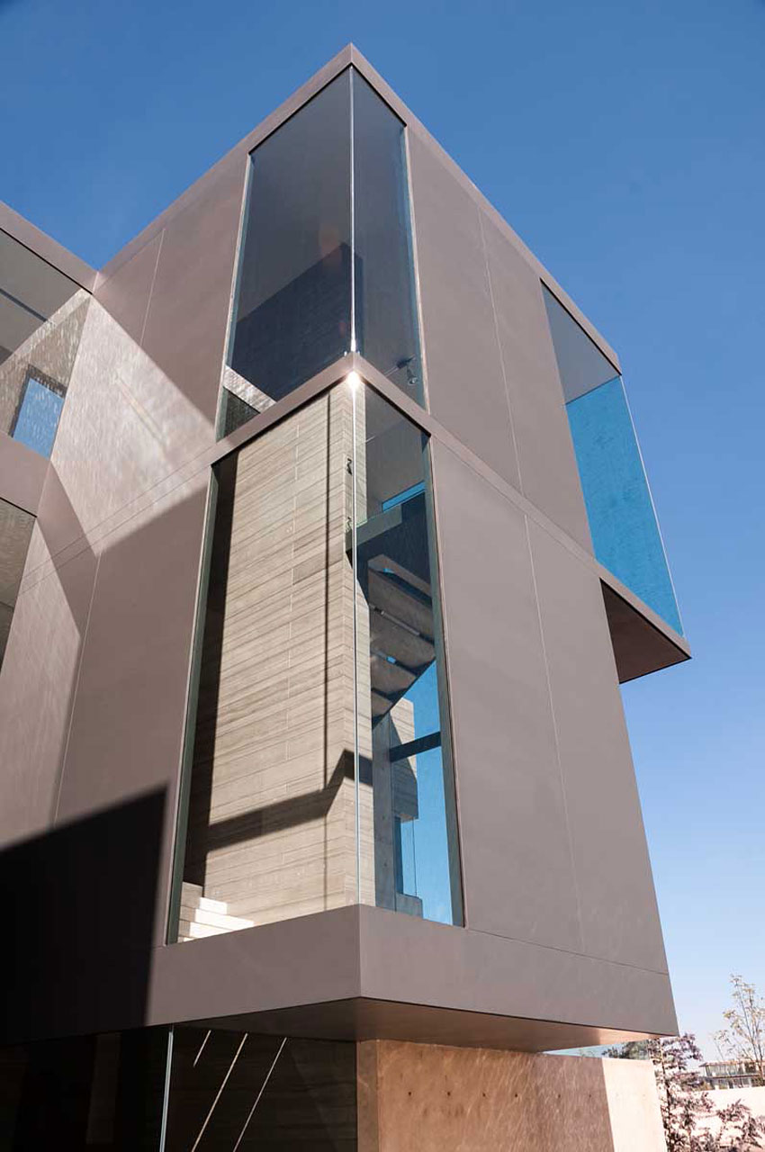 A Steel, Glass, Stone and Colored Concrete Home with Dramatic Central Staircase in Mexico City by Gantous Arquitectos (5)