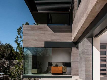 A Steel, Glass, Stone and Colored Concrete Home with Dramatic Central Staircase in Mexico City by Gantous Arquitectos (7)