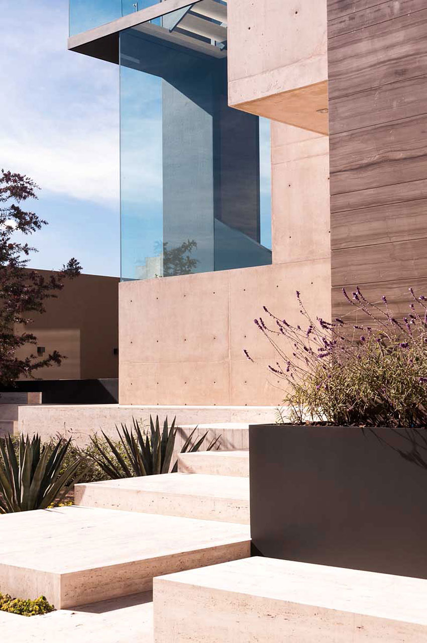 A Steel, Glass, Stone and Colored Concrete Home with Dramatic Central Staircase in Mexico City by Gantous Arquitectos (8)