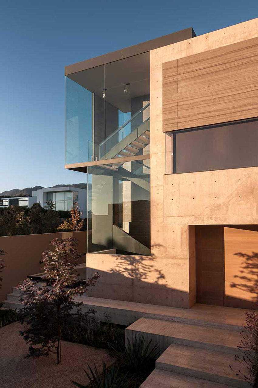 A Steel, Glass, Stone and Colored Concrete Home with Dramatic Central Staircase in Mexico City by Gantous Arquitectos (9)