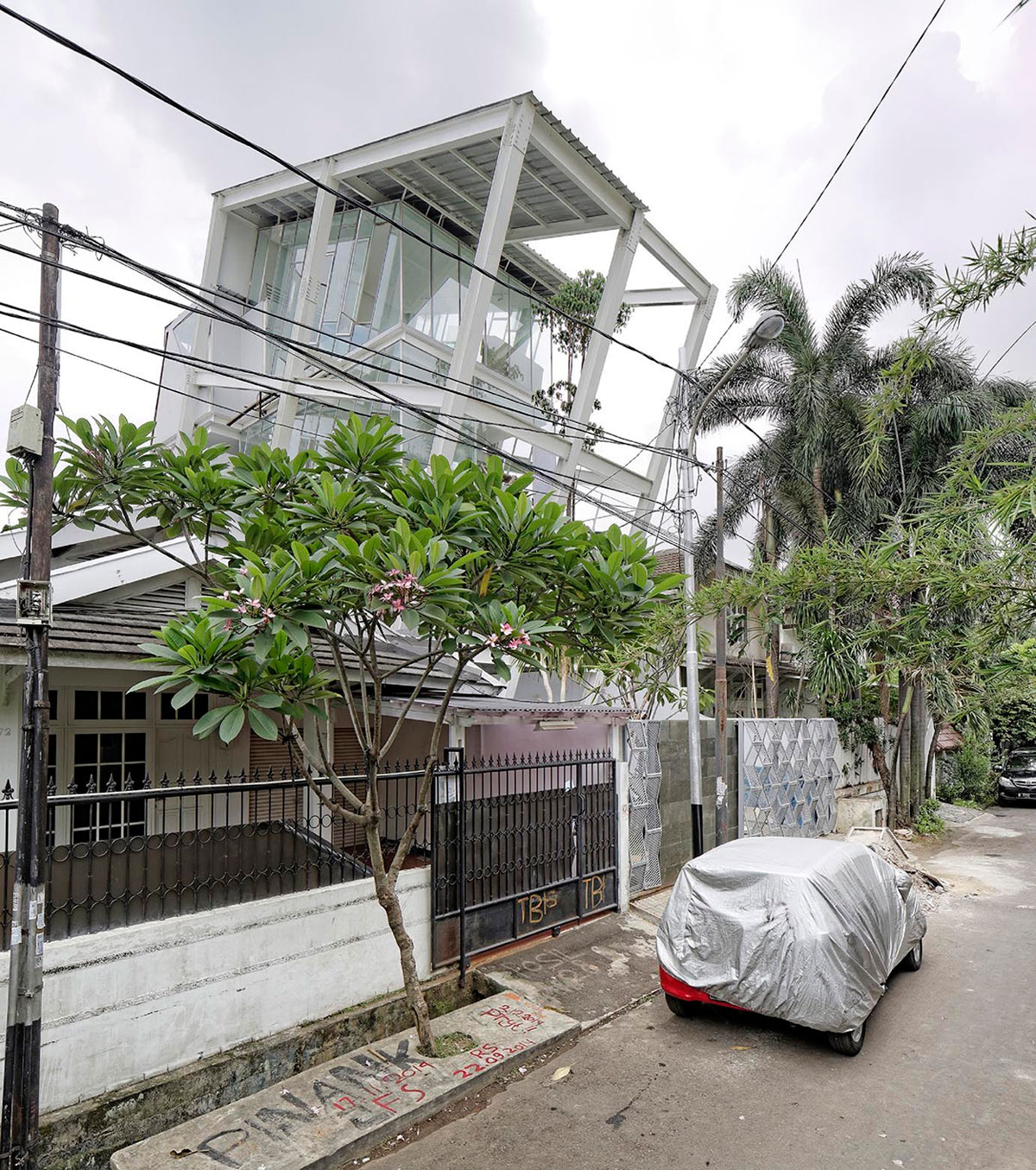 A Stunning Glass House with Slanted Steel Frame and Indoor Pool in Jakarta by Budi Pradono Architects (1)