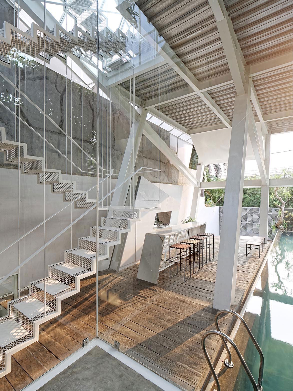 A Stunning Glass House with Slanted Steel Frame and Indoor Pool in Jakarta by Budi Pradono Architects (10)