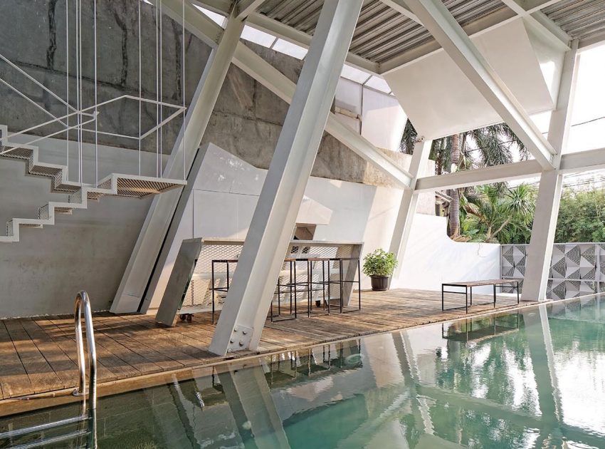 A Stunning Glass House with Slanted Steel Frame and Indoor Pool in Jakarta by Budi Pradono Architects (11)