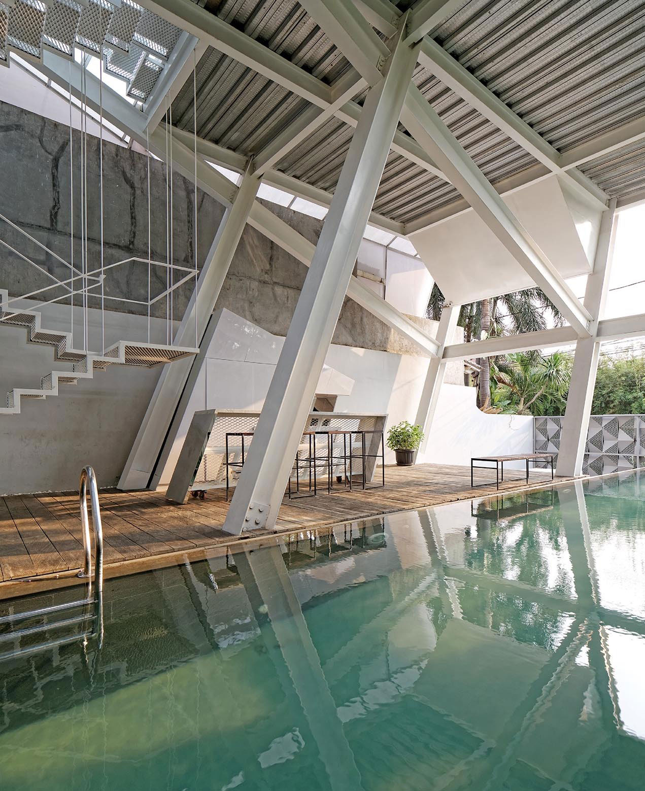 A Stunning Glass House with Slanted Steel Frame and Indoor Pool in Jakarta by Budi Pradono Architects (11)