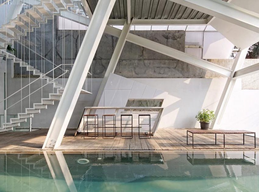 A Stunning Glass House with Slanted Steel Frame and Indoor Pool in Jakarta by Budi Pradono Architects (12)