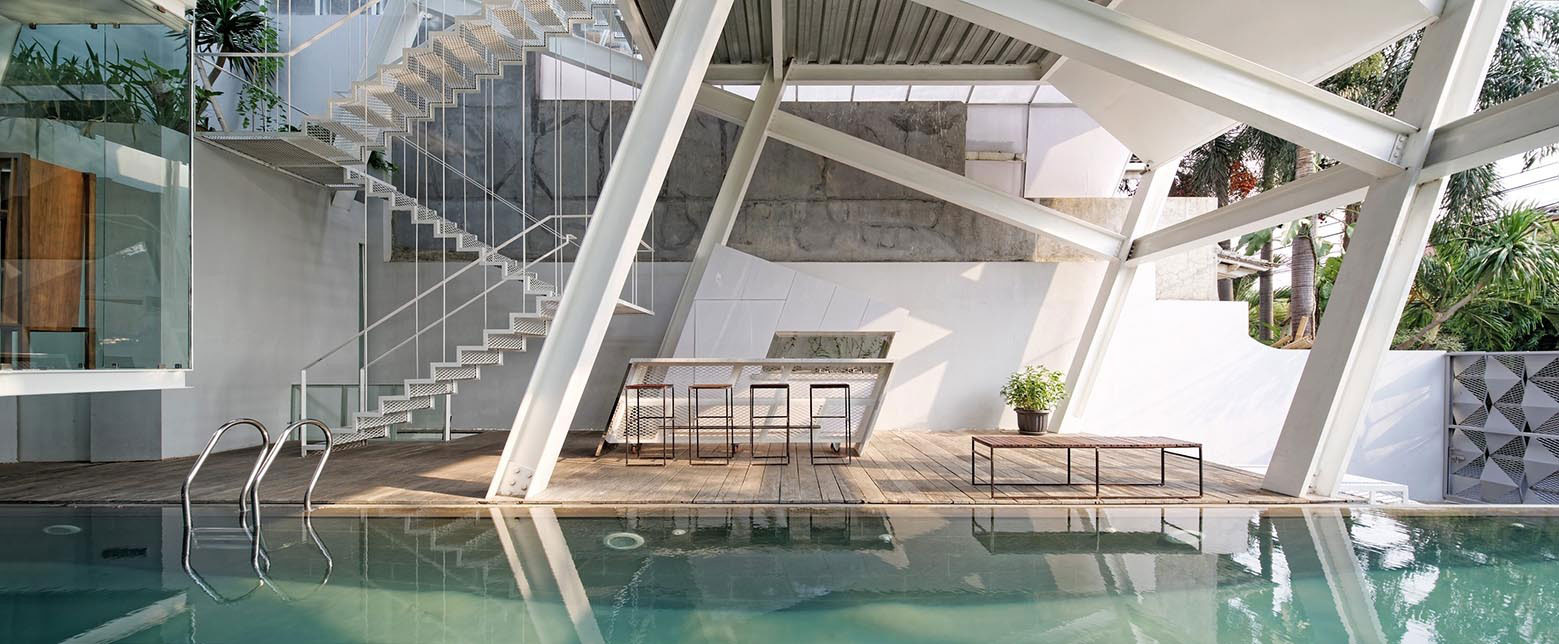 A Stunning Glass House with Slanted Steel Frame and Indoor Pool in Jakarta by Budi Pradono Architects (12)