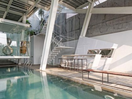 A Stunning Glass House with Slanted Steel Frame and Indoor Pool in Jakarta by Budi Pradono Architects (13)