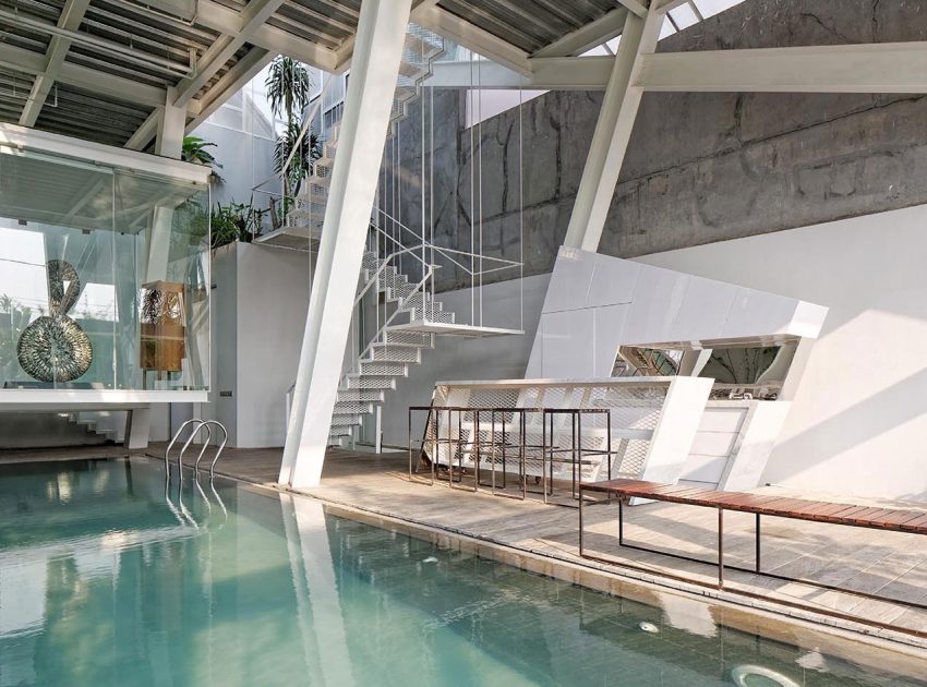 A Stunning Glass House with Slanted Steel Frame and Indoor Pool in Jakarta by Budi Pradono Architects (13)