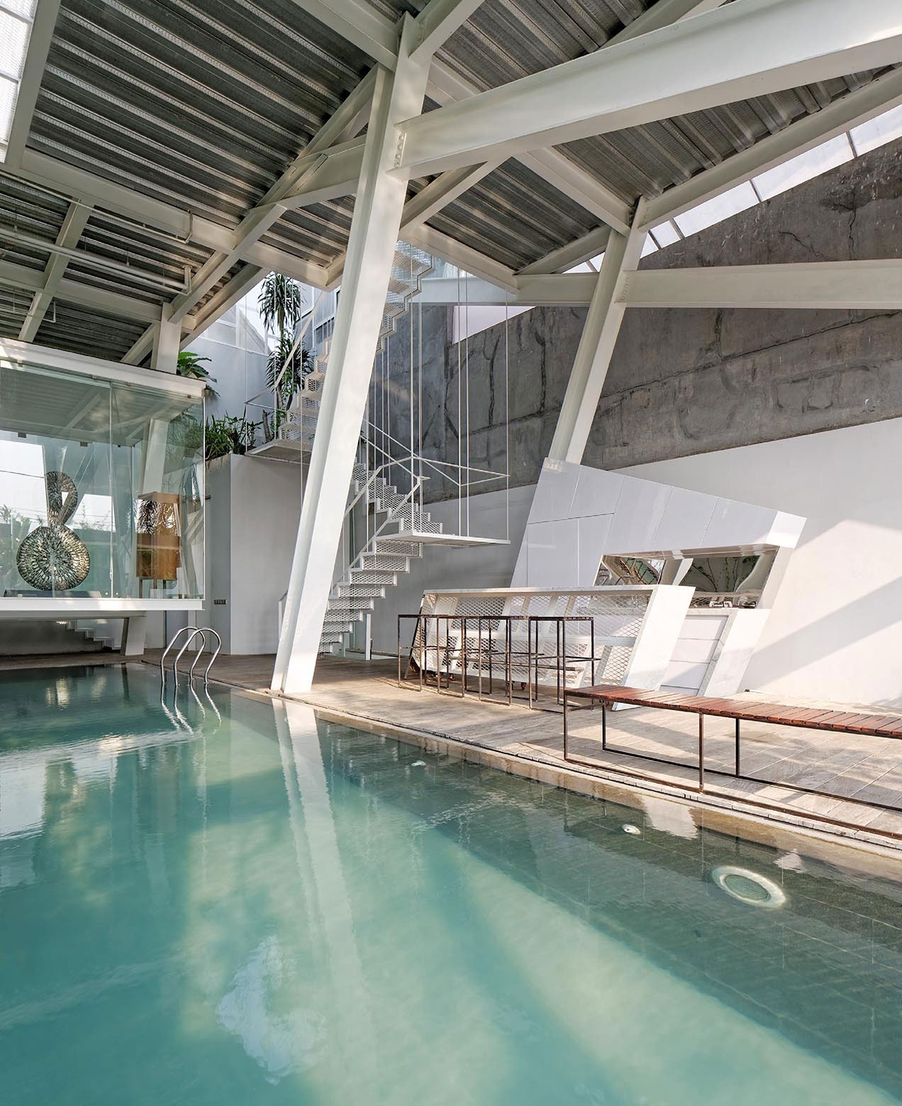 A Stunning Glass House with Slanted Steel Frame and Indoor Pool in Jakarta by Budi Pradono Architects (13)