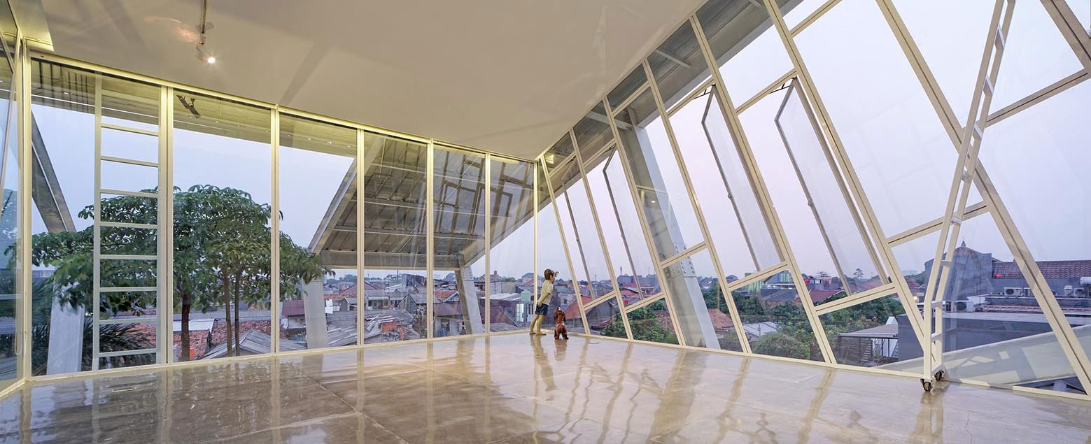 A Stunning Glass House with Slanted Steel Frame and Indoor Pool in Jakarta by Budi Pradono Architects (14)