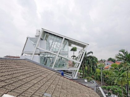 A Stunning Glass House with Slanted Steel Frame and Indoor Pool in Jakarta by Budi Pradono Architects (2)