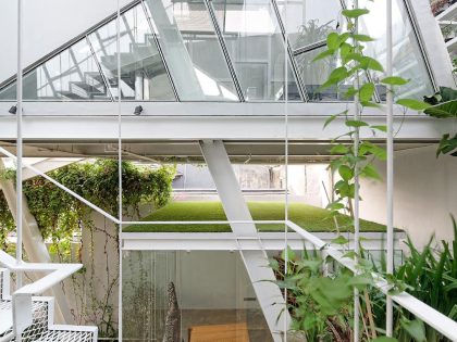 A Stunning Glass House with Slanted Steel Frame and Indoor Pool in Jakarta by Budi Pradono Architects (3)