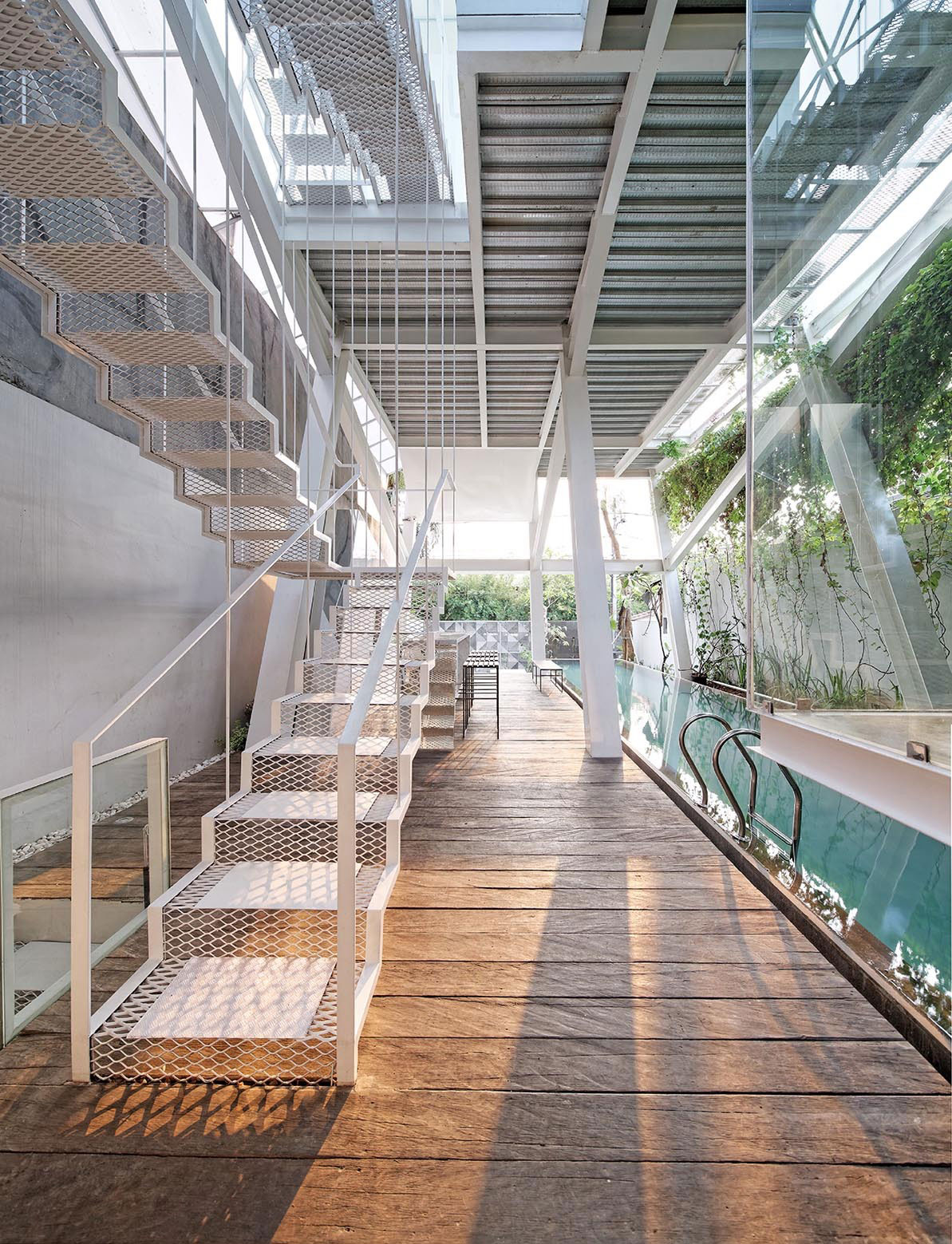 A Stunning Glass House with Slanted Steel Frame and Indoor Pool in Jakarta by Budi Pradono Architects (5)