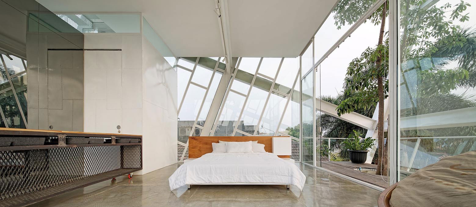 A Stunning Glass House with Slanted Steel Frame and Indoor Pool in Jakarta by Budi Pradono Architects (6)