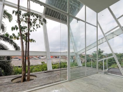 A Stunning Glass House with Slanted Steel Frame and Indoor Pool in Jakarta by Budi Pradono Architects (8)