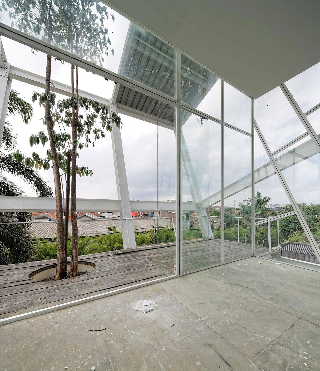 A Stunning Glass House with Slanted Steel Frame and Indoor Pool in Jakarta by Budi Pradono Architects (8)
