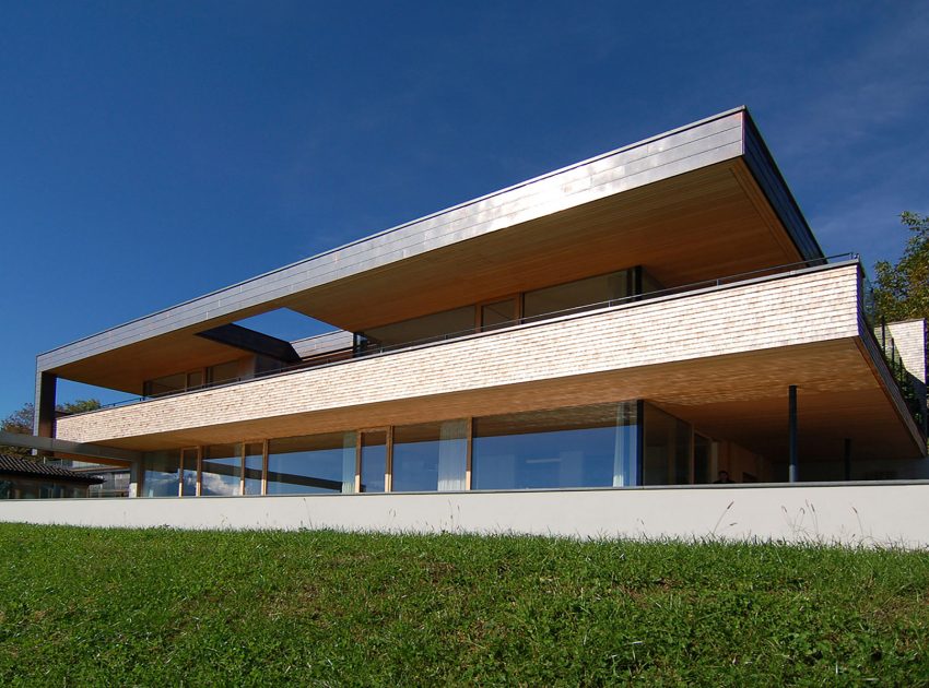 A Stunning and Elegant Home Built on a Slope Overlooks Beautiful Mountains of Liechtenstein by k m architektur (1)