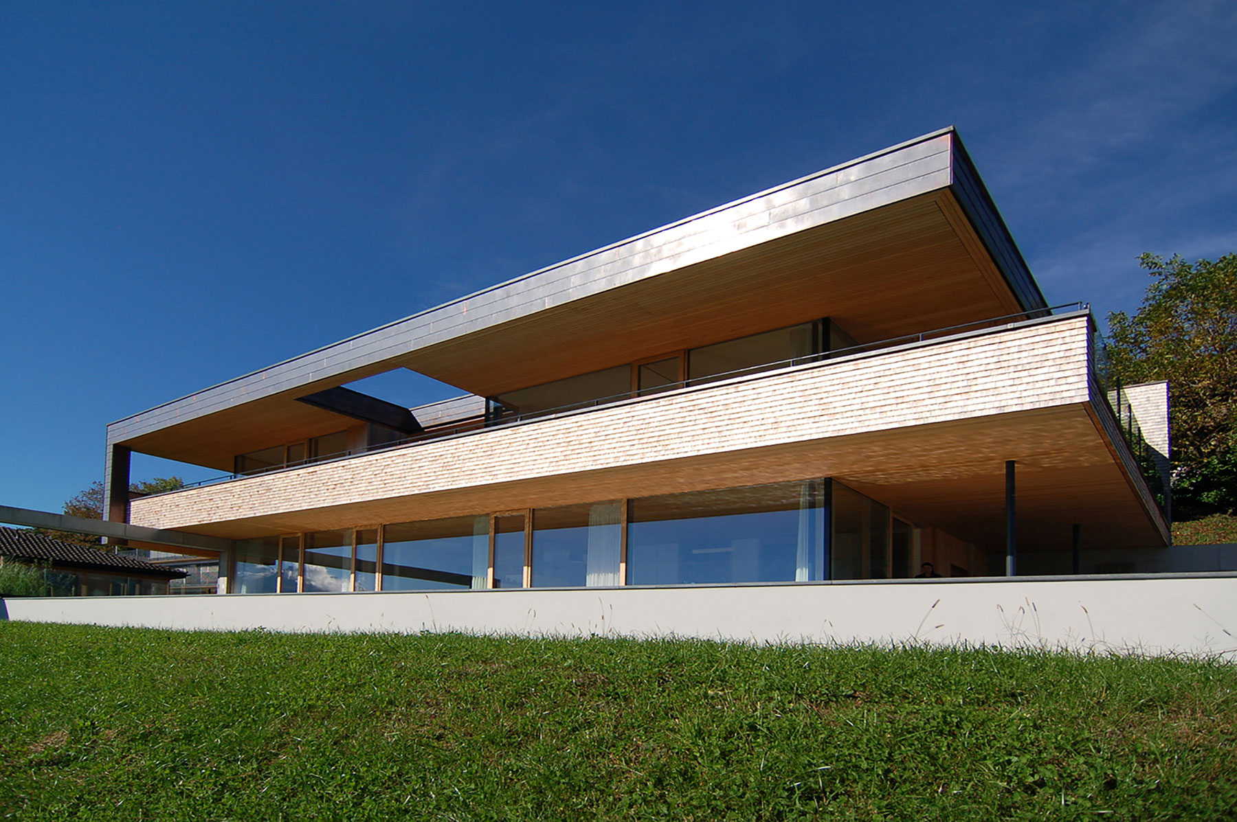 A Stunning and Elegant Home Built on a Slope Overlooks Beautiful Mountains of Liechtenstein by k m architektur (1)