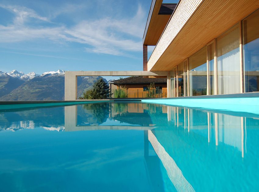 A Stunning and Elegant Home Built on a Slope Overlooks Beautiful Mountains of Liechtenstein by k m architektur (10)