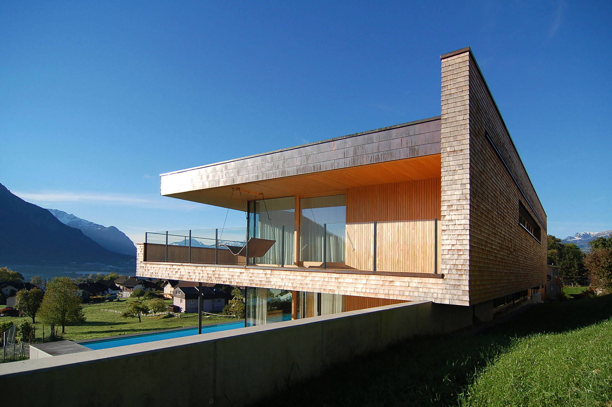 A Stunning and Elegant Home Built on a Slope Overlooks Beautiful Mountains of Liechtenstein by k m architektur (15)