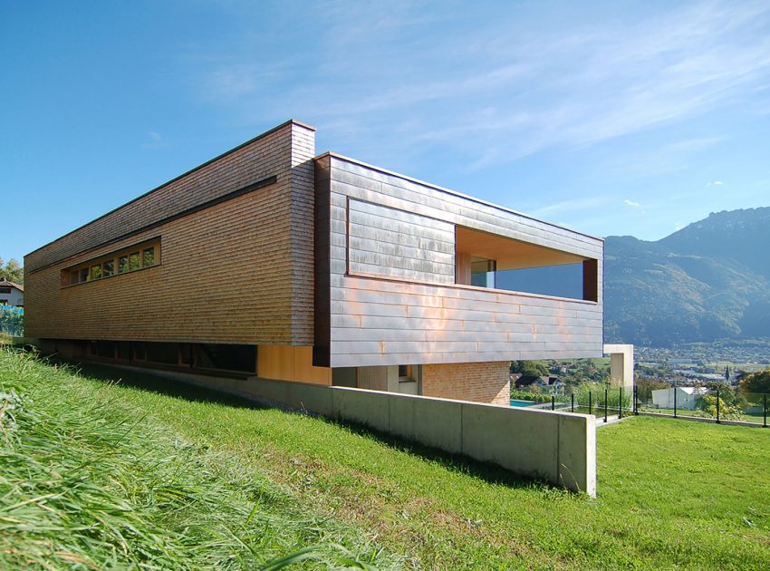 A Stunning and Elegant Home Built on a Slope Overlooks Beautiful Mountains of Liechtenstein by k m architektur (3)