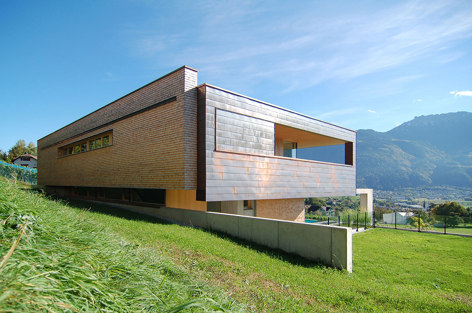 A Stunning and Elegant Home Built on a Slope Overlooks Beautiful Mountains of Liechtenstein by k m architektur (3)