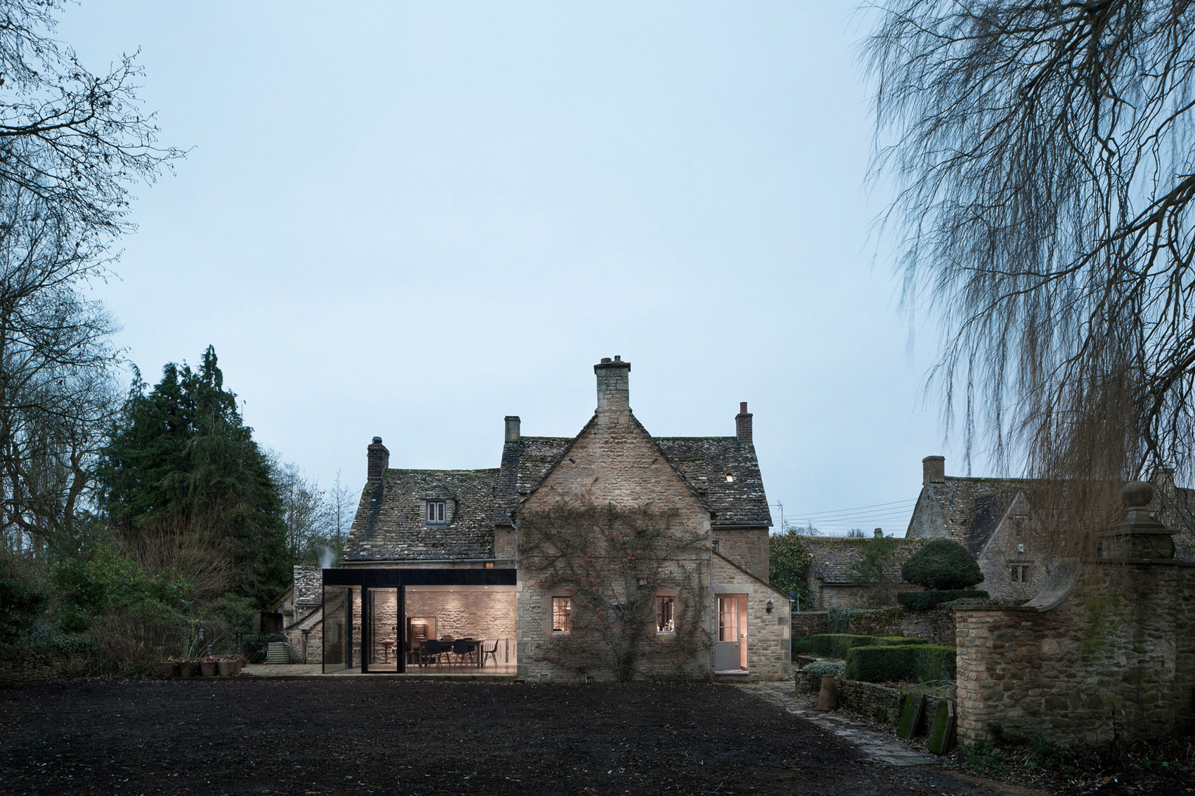A Stylish Modern Home with Stone Walls and Glass Facade in Oxford, England by Jonathan Tuckey Design (1)