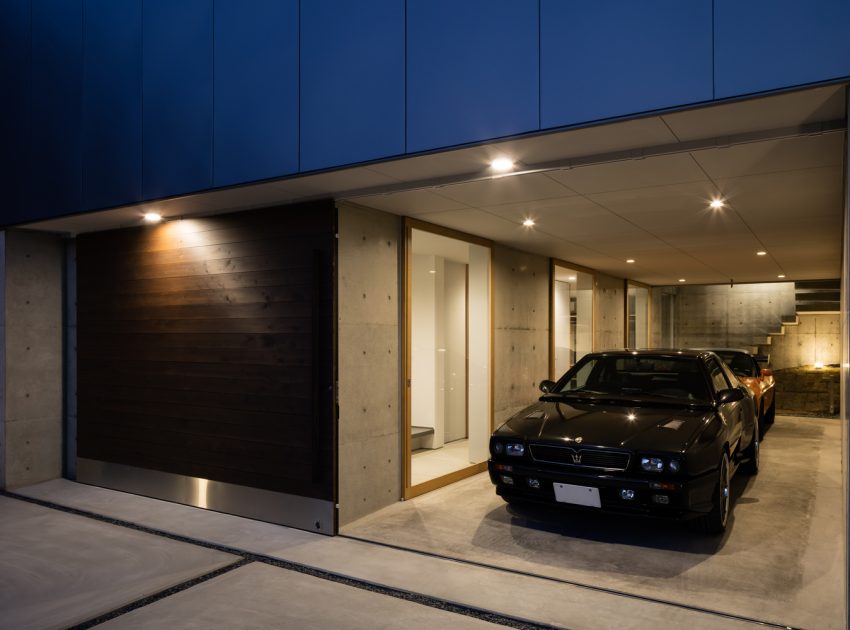 A Warm and Cozy Concrete Home for a Car and Bike Enthusiast in Kawagoe by Horibe Associates (15)