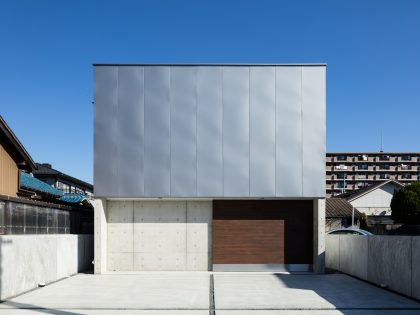 A Warm and Cozy Concrete Home for a Car and Bike Enthusiast in Kawagoe by Horibe Associates (2)