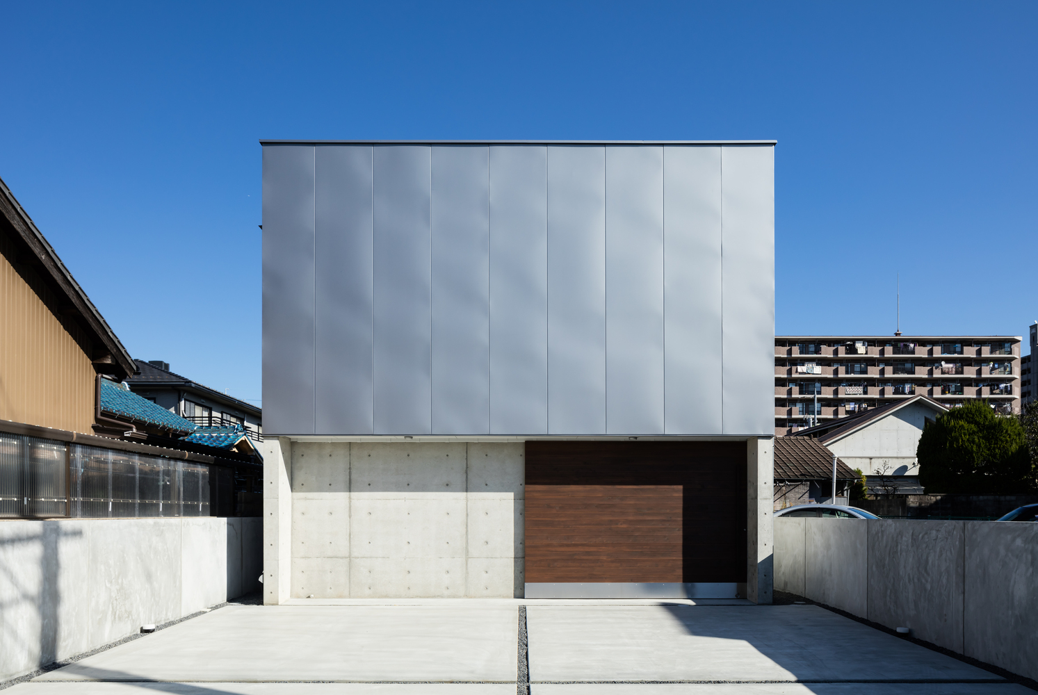 A Warm and Cozy Concrete Home for a Car and Bike Enthusiast in Kawagoe by Horibe Associates (2)