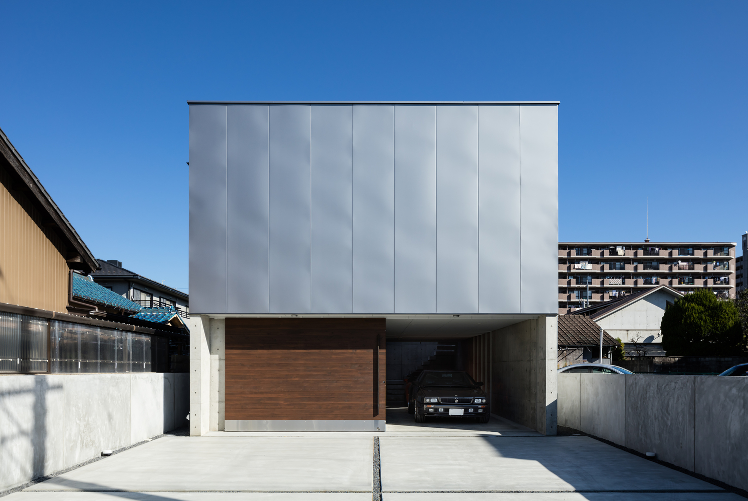A Warm and Cozy Concrete Home for a Car and Bike Enthusiast in Kawagoe by Horibe Associates (3)