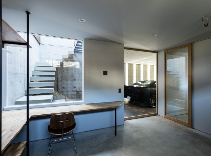 A Warm and Cozy Concrete Home for a Car and Bike Enthusiast in Kawagoe by Horibe Associates (8)