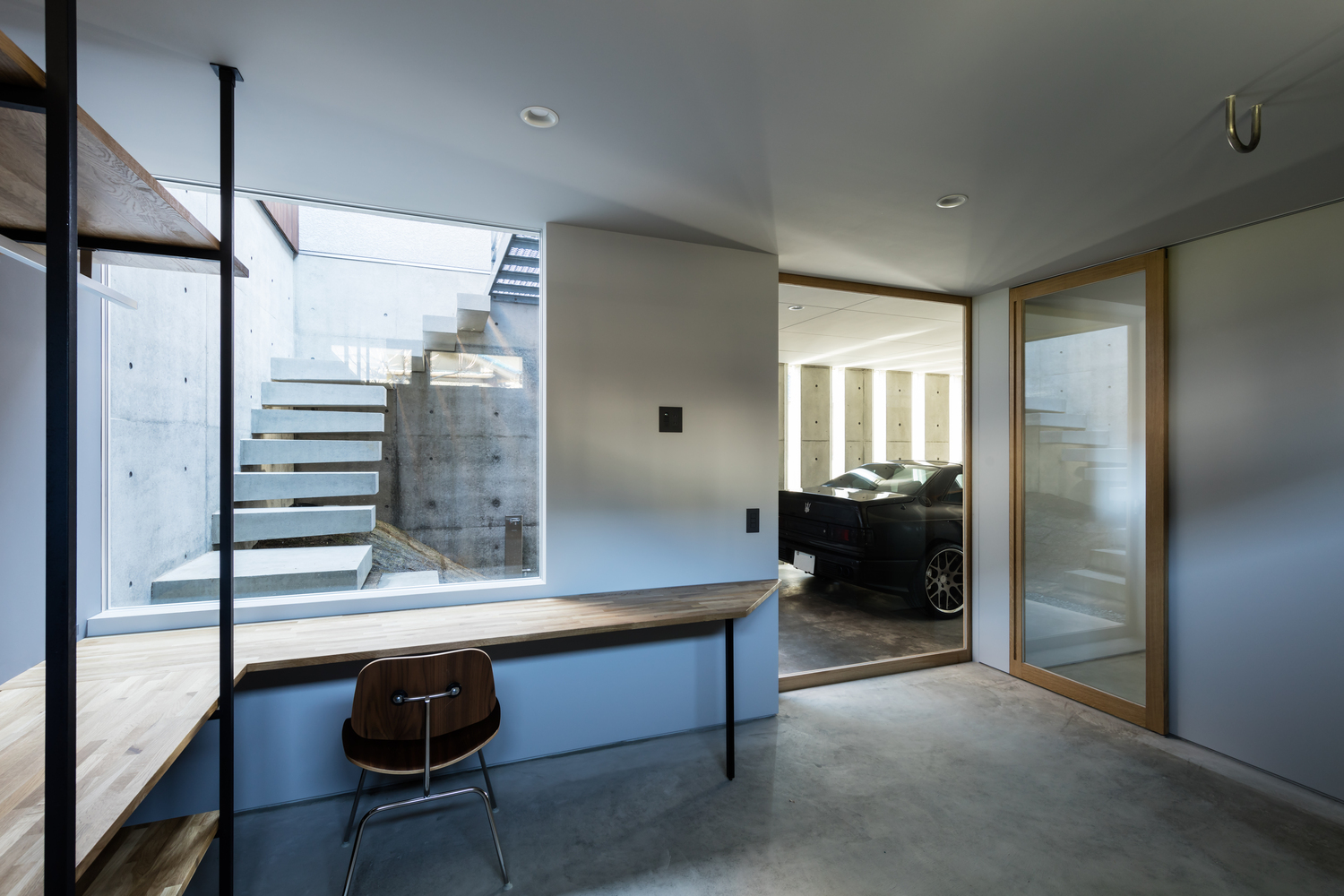 A Warm and Cozy Concrete Home for a Car and Bike Enthusiast in Kawagoe by Horibe Associates (8)