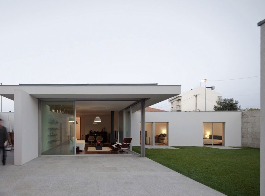 An Elegant Modern House with Courtyards and Pool Flanked by Stone Walls in Porto, Portugal by Sérgio Koch (3)