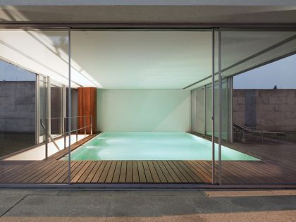 An Elegant Modern House with Courtyards and Pool Flanked by Stone Walls in Porto, Portugal by Sérgio Koch (6)