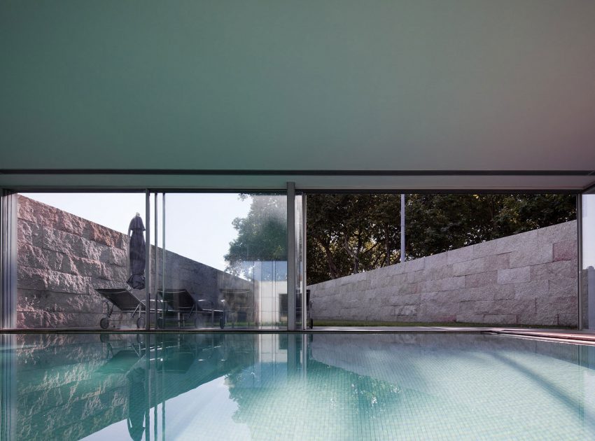 An Elegant Modern House with Courtyards and Pool Flanked by Stone Walls in Porto, Portugal by Sérgio Koch (8)