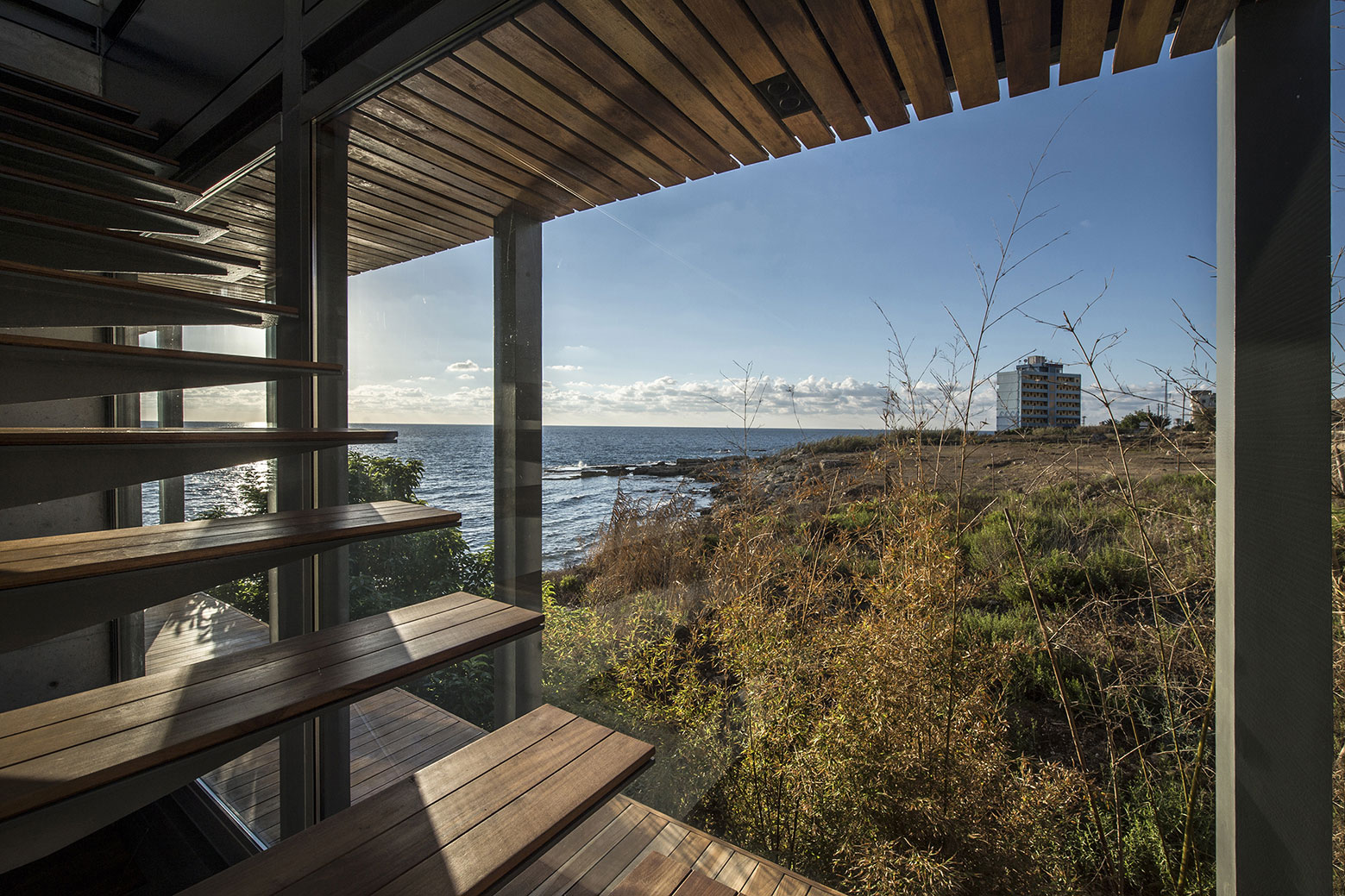 An Elegant Modern Seaside Home Perched on the Edge of a Cliff with Rooftop Deck in Amchit, Lebanon by BLANKPAGE Architects (11)