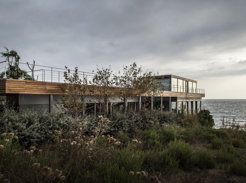 An Elegant Modern Seaside Home Perched on the Edge of a Cliff with Rooftop Deck in Amchit, Lebanon by BLANKPAGE Architects (4)