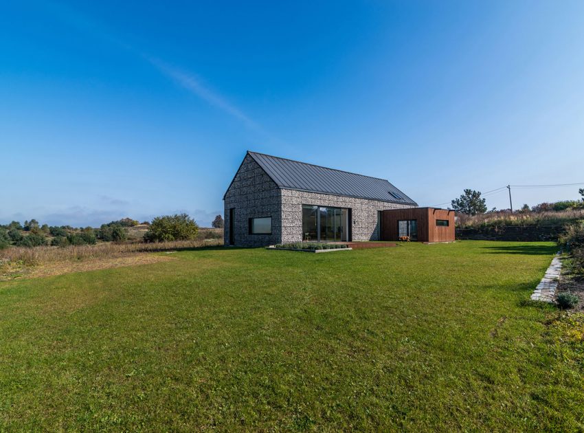 An Elegant and Airy Contemporary Home with Gabion Walls in Zawiercie, Poland by Kropka Studio (1)