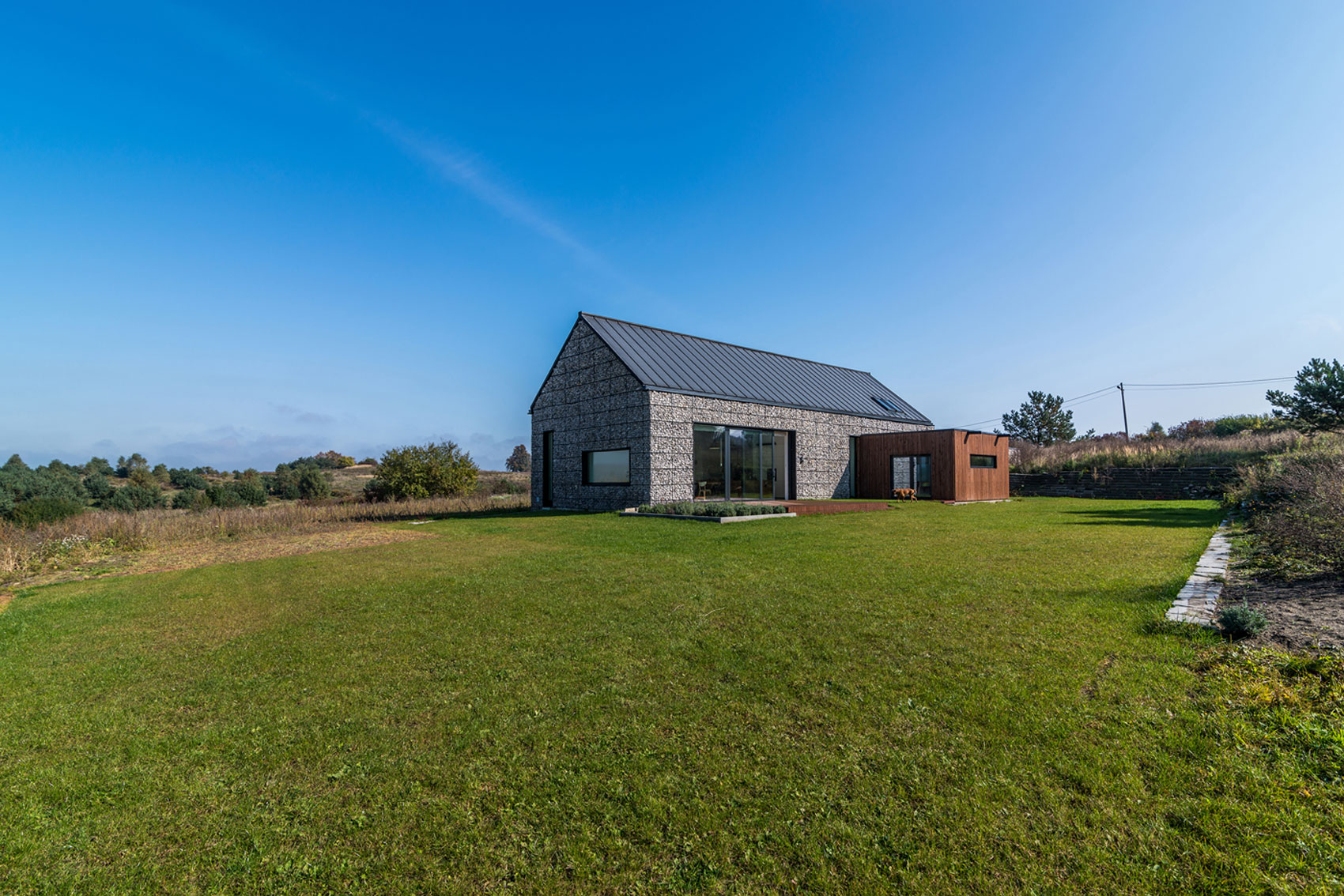 An Elegant and Airy Contemporary Home with Gabion Walls in Zawiercie, Poland by Kropka Studio (1)