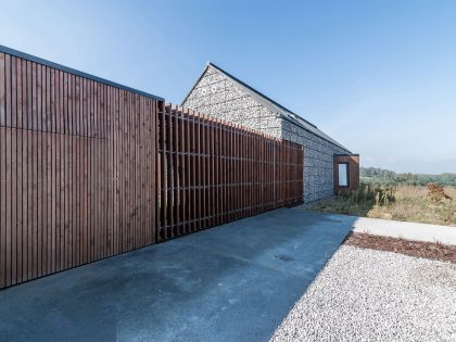 An Elegant and Airy Contemporary Home with Gabion Walls in Zawiercie, Poland by Kropka Studio (10)