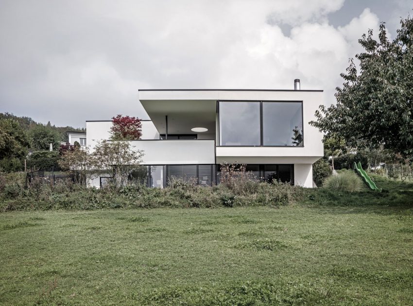 A Bright Modern Home with White Facade and Large Glass Windows in Uitikon, Switzerland by Meier Architekten (1)