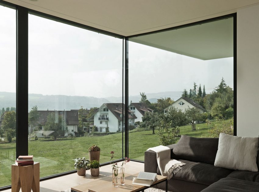 A Bright Modern Home with White Facade and Large Glass Windows in Uitikon, Switzerland by Meier Architekten (10)